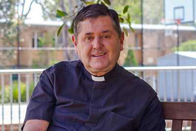 Fr Chris Riley stamp